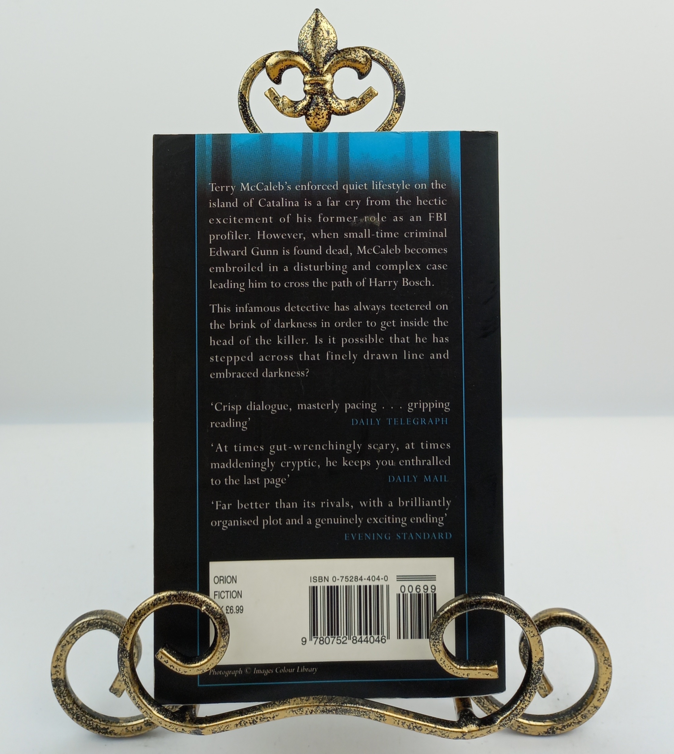 A Darkness More Than Night Knygospigiau lt