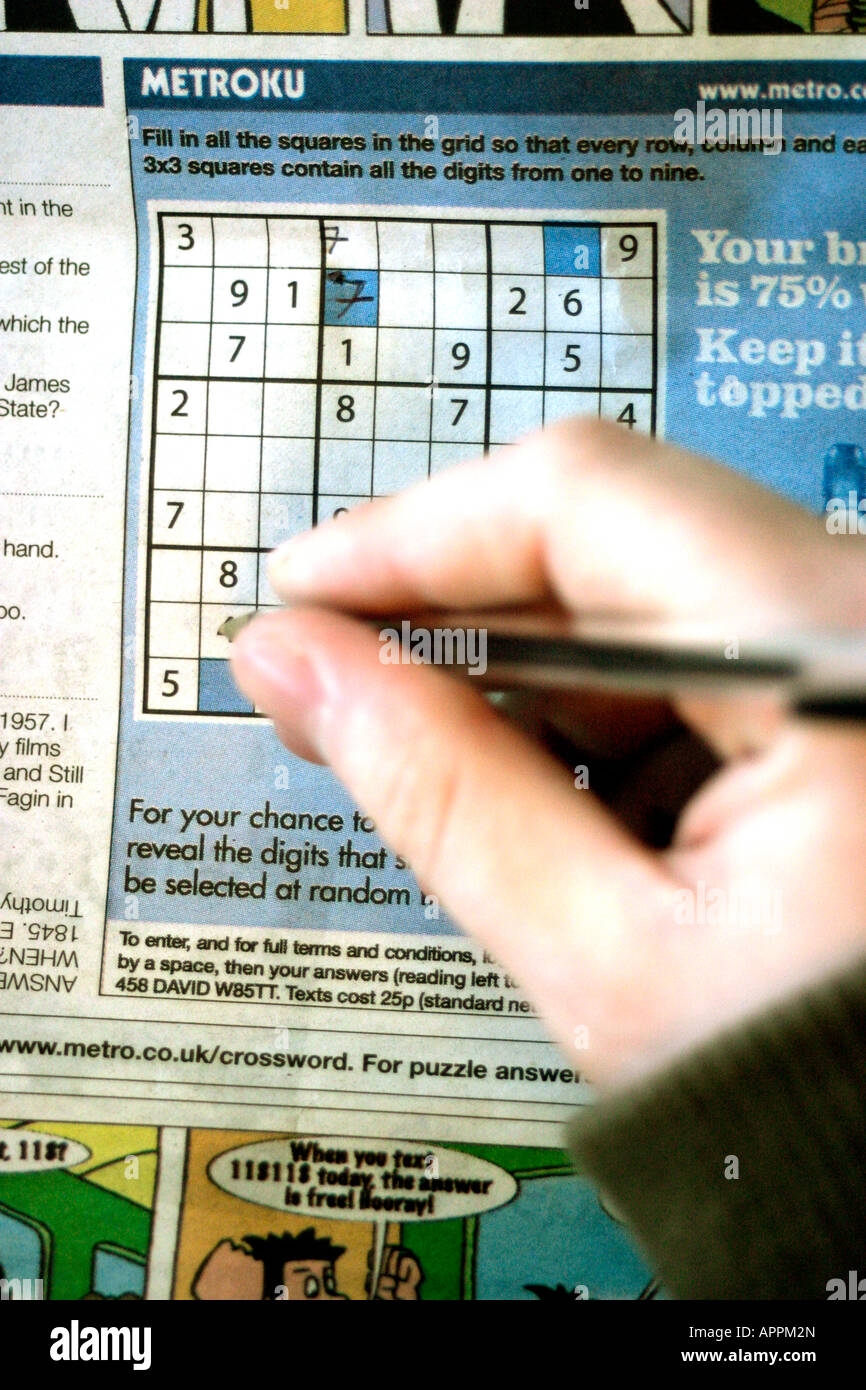 Completing A Suduko Number Puzzle In A Local Newspaper Metro 
