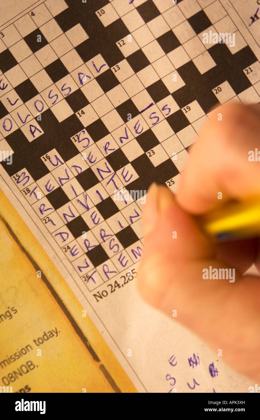 Person Doing The Cryptic Crossword Puzzle In The Guardian Newspaper UK Stock Photo Alamy