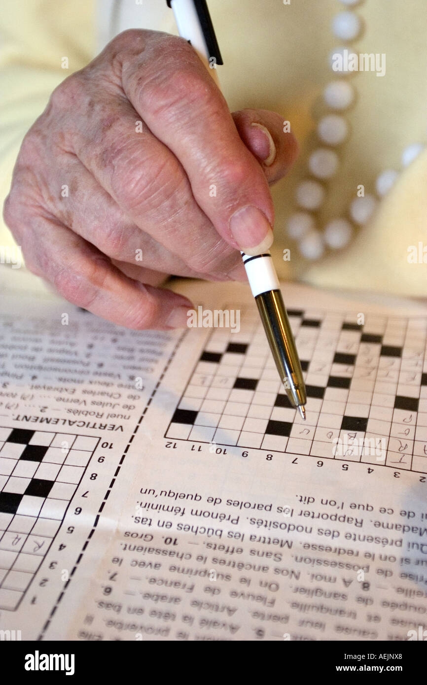 Portrait Of A Senior Woman Doing A Crossword Puzzle Stock Photo Alamy